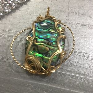 Handmade pendant gold wire with shell.  New